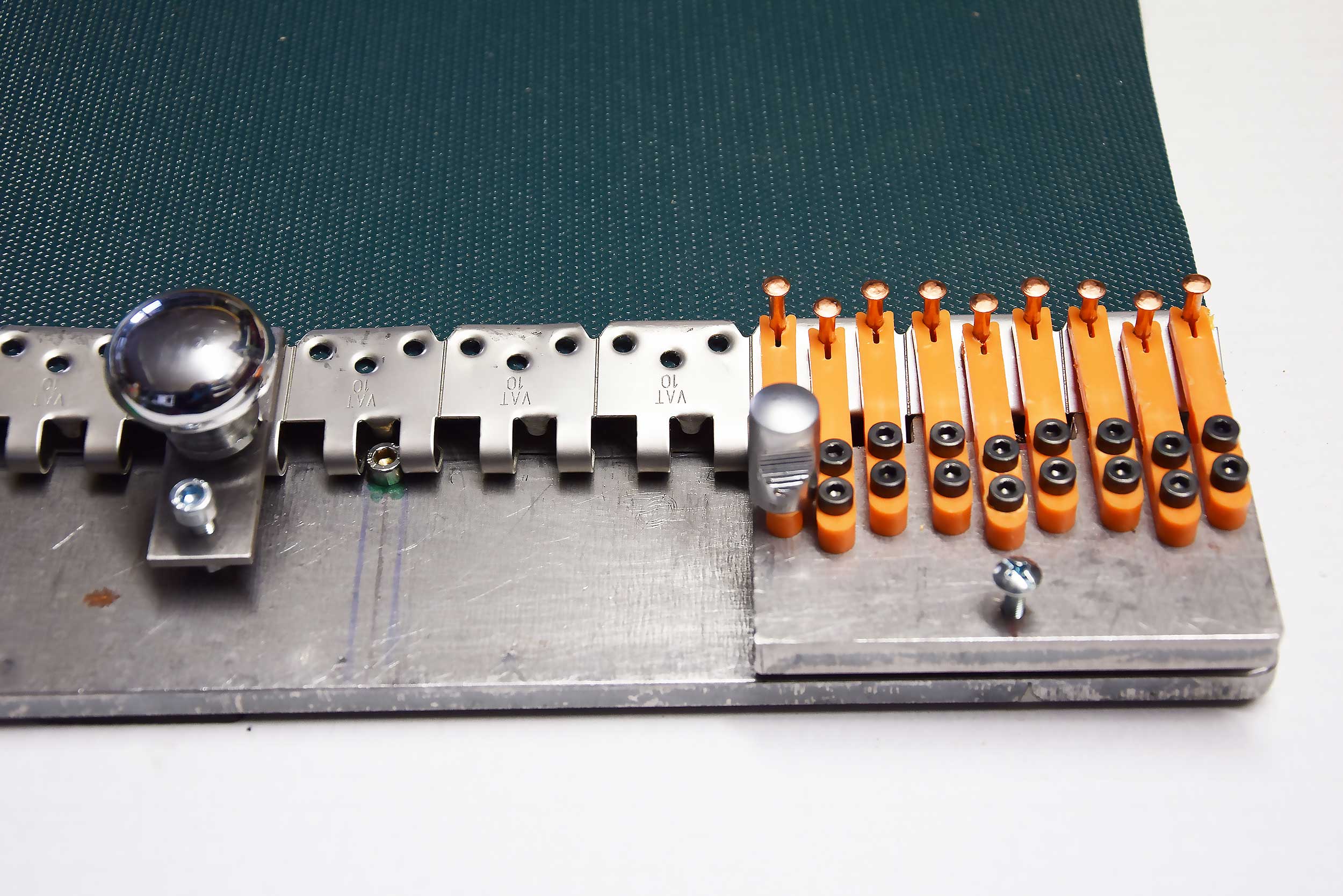 PERFORATED PLATE AT 24 AND NAIL-HOLDER AT34