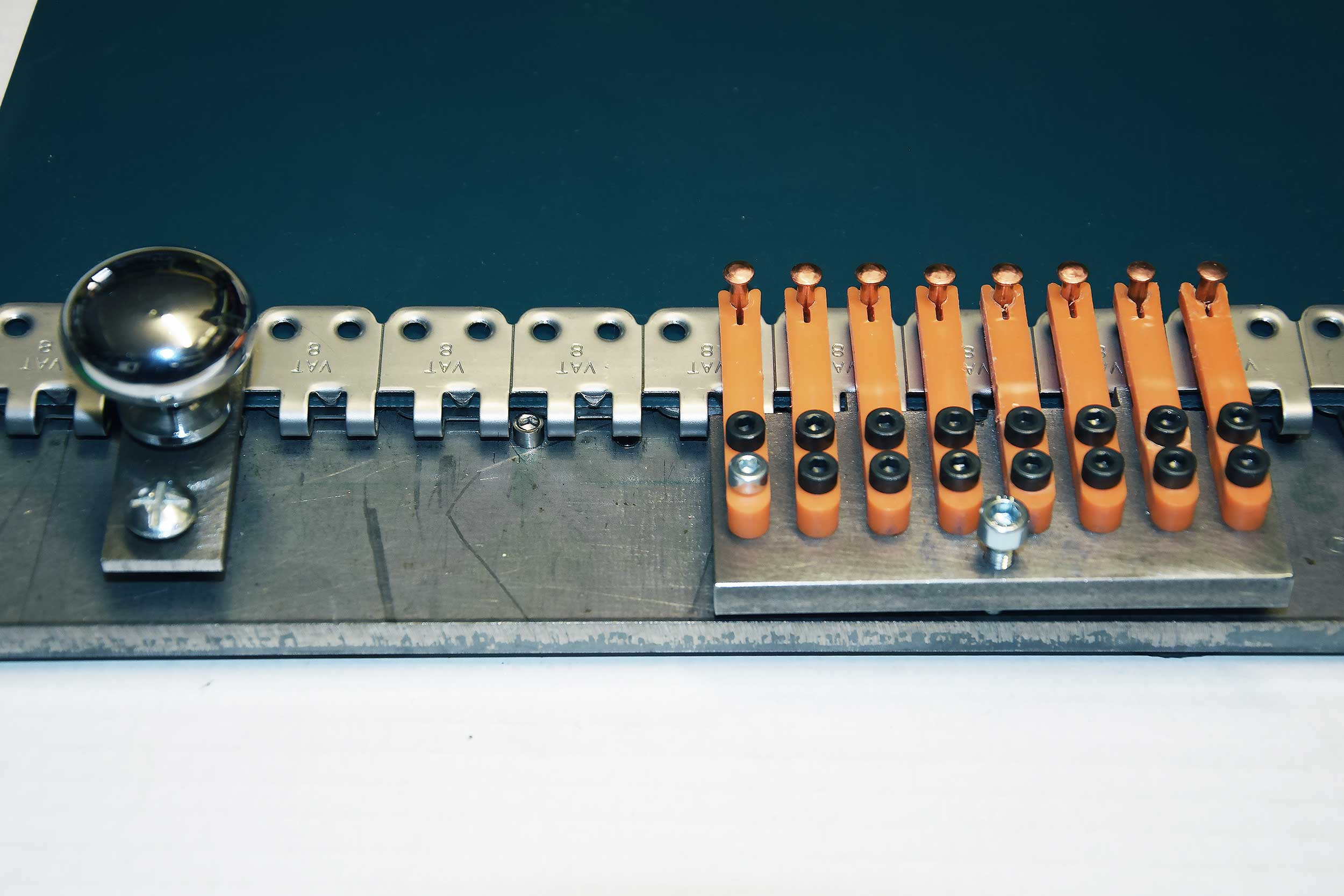 PERFORATED PLATE AT 23 AND NAIL-HOLDER AT 33
